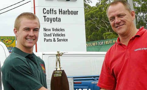 Hot shot: Budding rifle shooter Brendan Lean is presented with his championship trophy by Coffs Harbour Toyota representative Brett Johnson. Hot shot: Budding rifle shooter Brendan Lean is presented with his championship trophy by Coffs Harbour Toyota representative Brett Johnson.